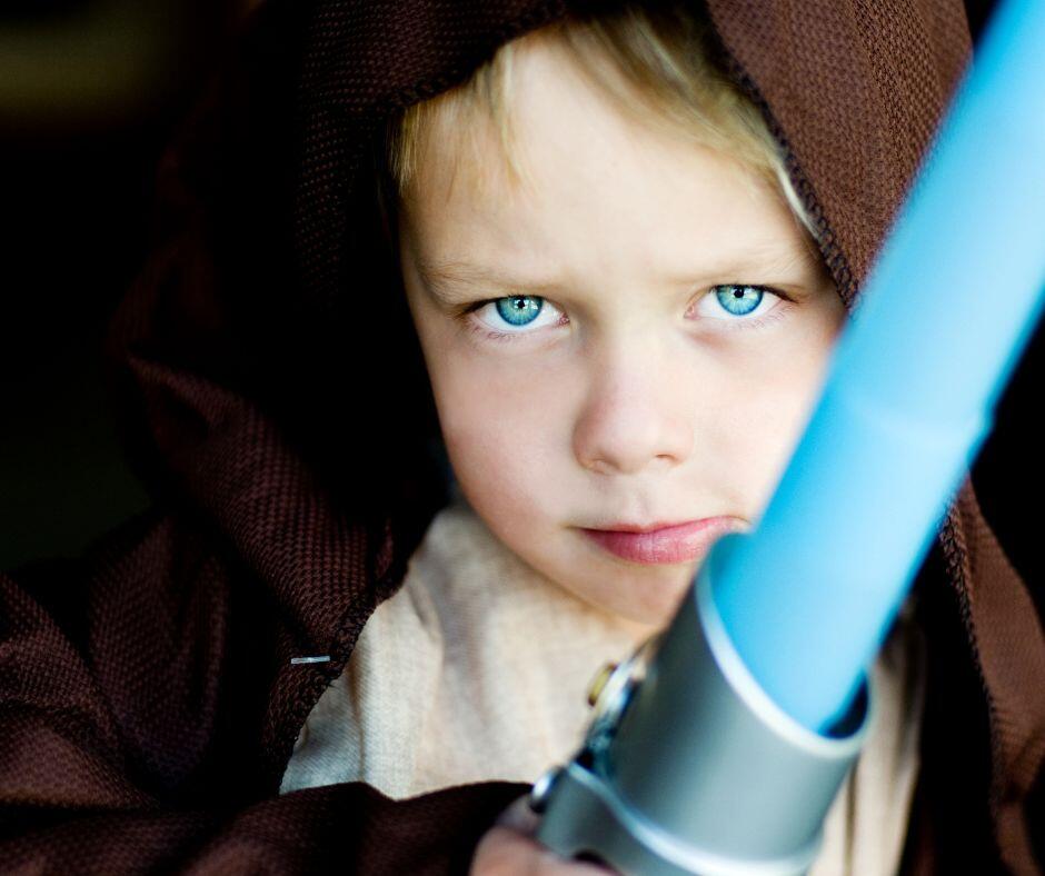adopted boy dressed as jedi from star wars