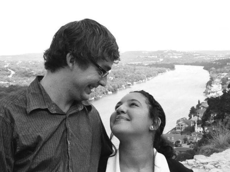 Adoptive parents Dany and Jeremy with Lake Austin in the background