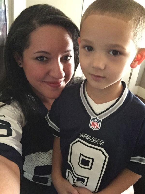 Hopeful adoptive mom Dany with nephew wearing Dallas Cowboys jersey