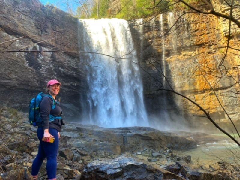 Georgia adoptive mom hiking in front of a waterfall