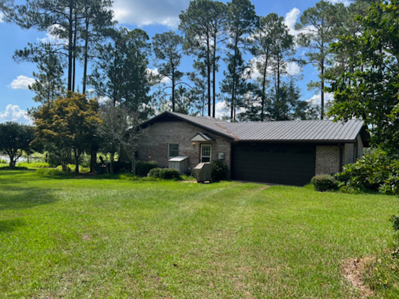 Adoptive mom's house in rural Georgia among big trees