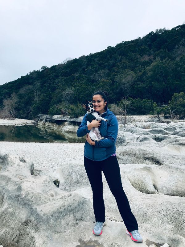 Single adoptive parent Alyah with Cash at a creek