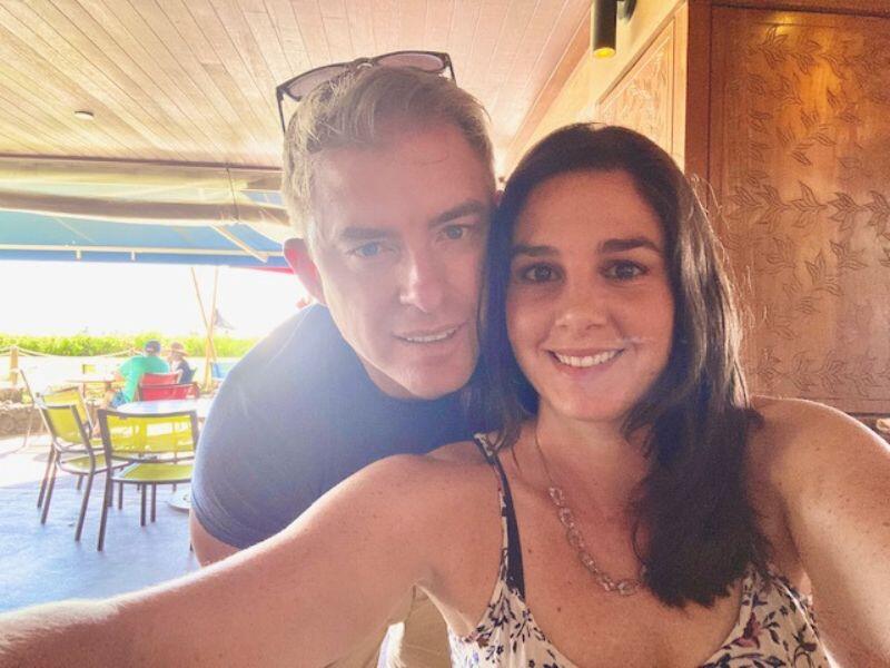 Adoptive parents Hali and Matt at an outdoor restaurant