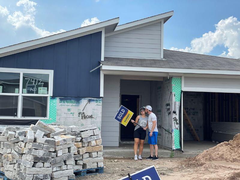 Jenny and Steph, an Austin, TX couple that wants to adopt a baby, in their home with their extended family