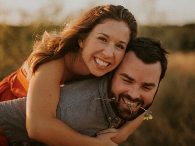 Austin, TX parents who hope to adopt, hugging at sunset