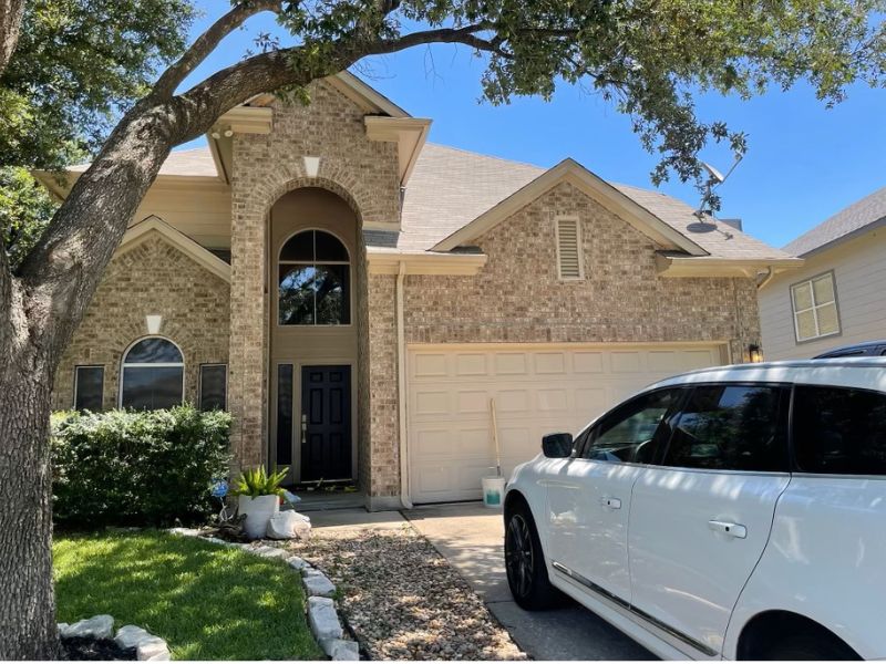 two-story brick home in Austin where prospective adoptive parents live