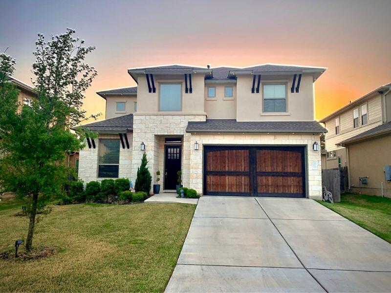 exterior of two story home owned by Austin dads looking to adopt