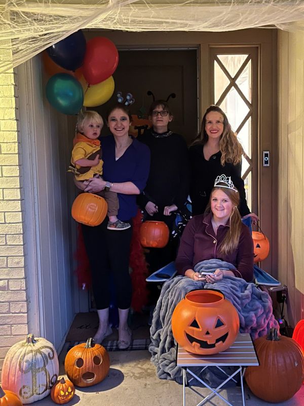 White adoptive mom dressed up for Halloween with family