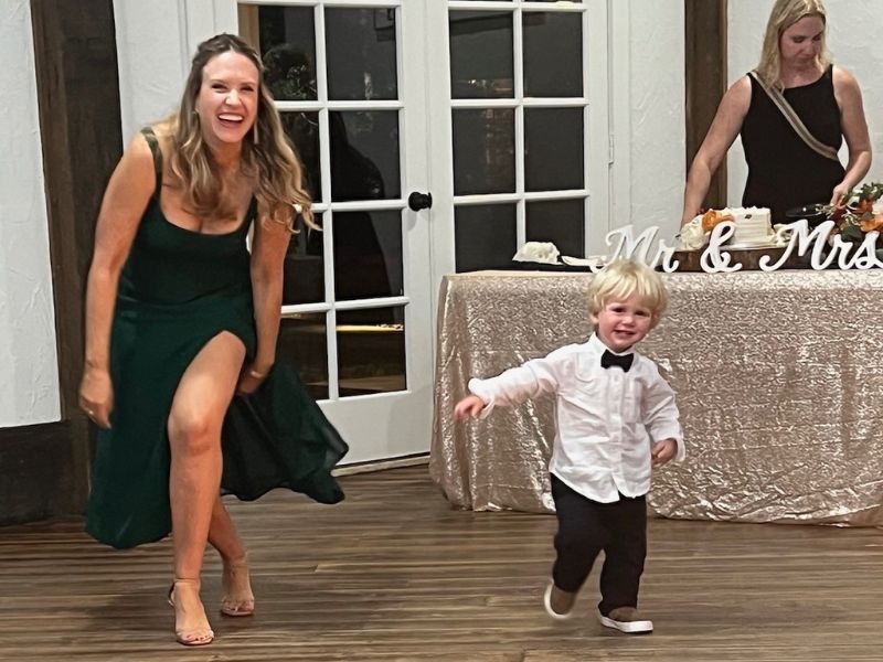 Adoptive mom dancing at a wedding with young nephew