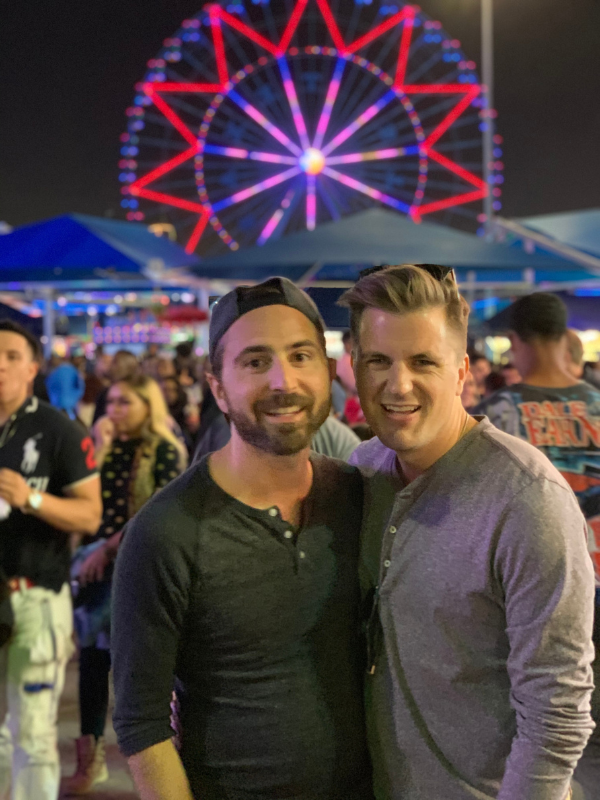 Gay adoptive parents wedding photo at sunset