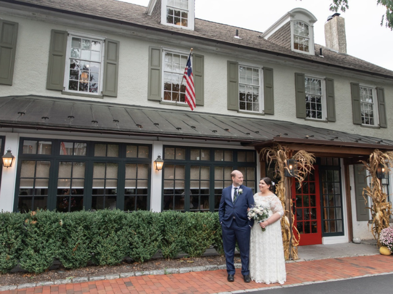 Houston adoptive couple at their wedding walking in front of a historic building