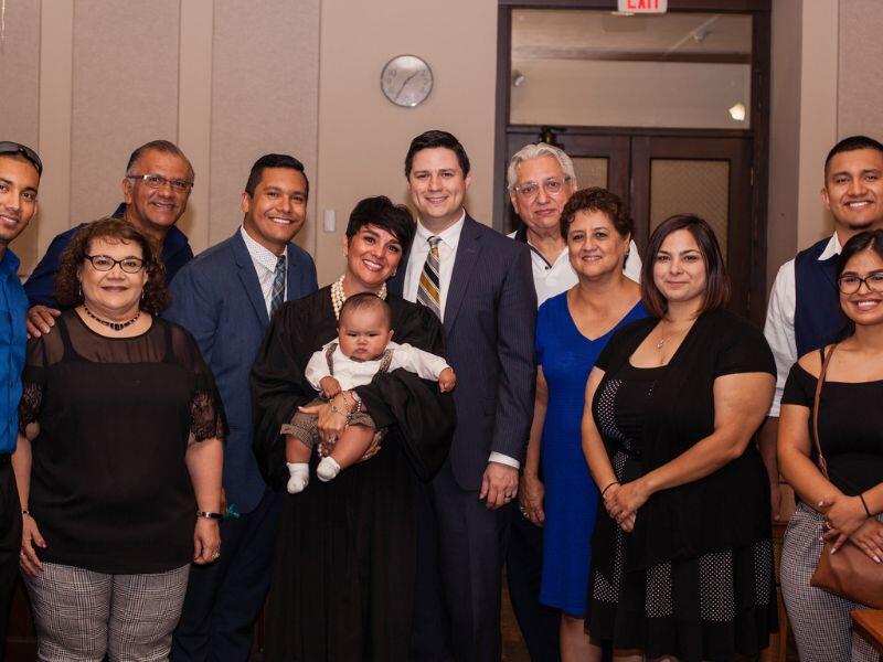 Ruben and Miguel, a gay couple that wants to adopt, with extended family at adoption day in court