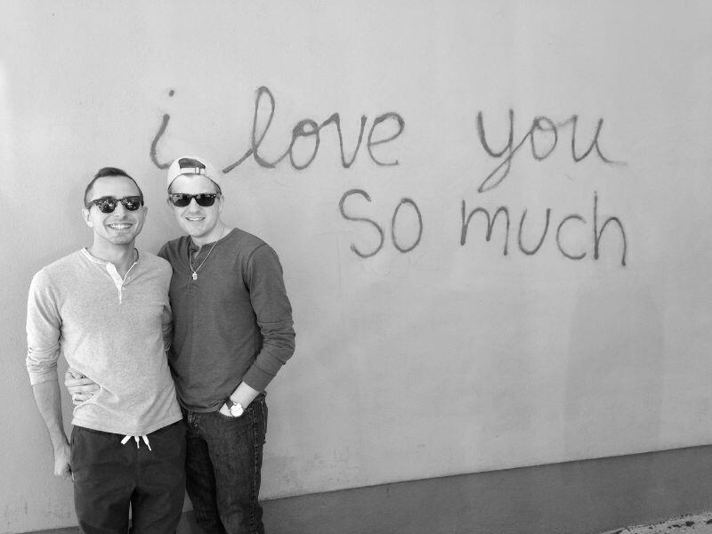 Blake and Micah in front of Austin's I Love You So Much mural