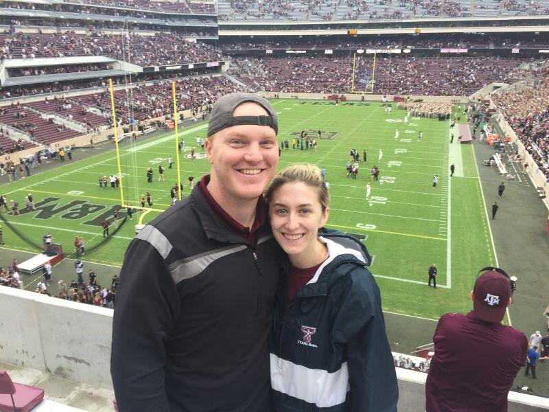 Midland adoptive parents at a college football game